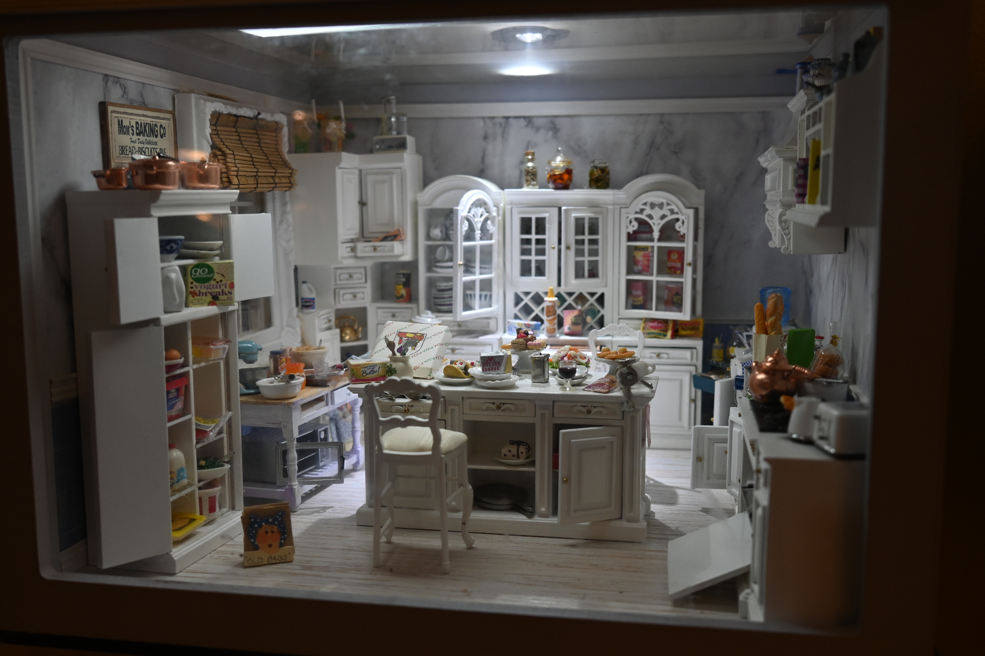 Mom's Baking Co. — full framed view of the marble kitchen through its glass front